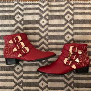 Red faux leather booties w/ gold buckles & detail